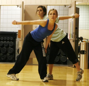 Two students practice the partner dance for "Party People."